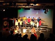 Grade 9 students performing on stage