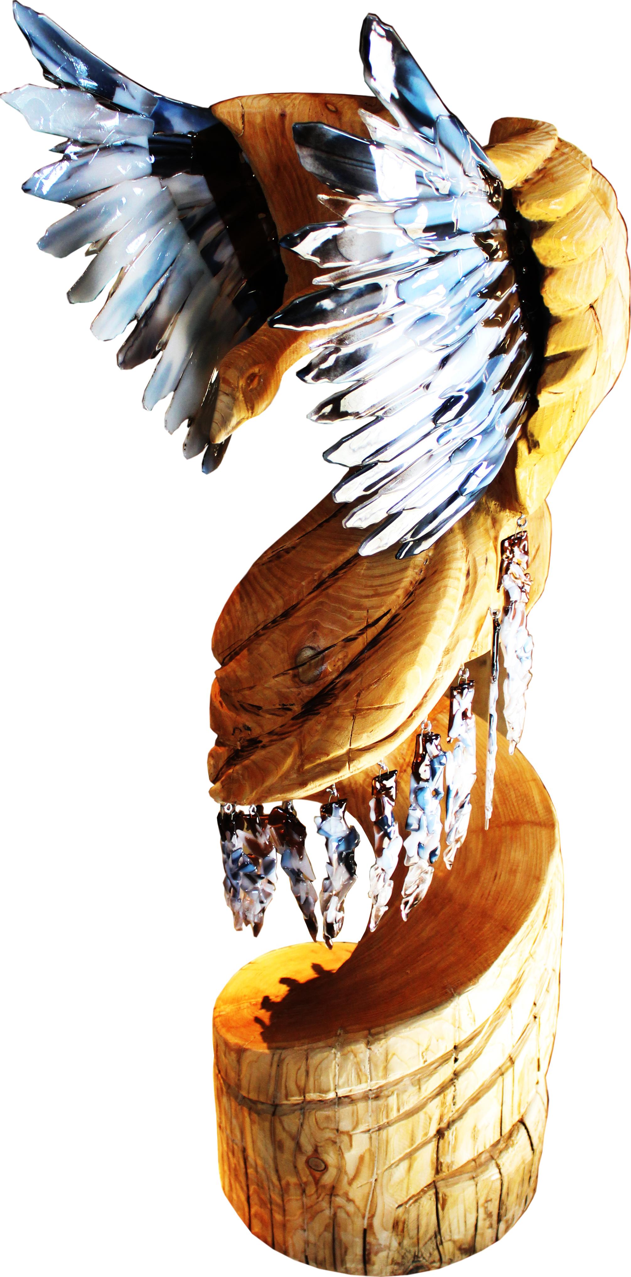 A fused glass woodcarving piece representing the element of air