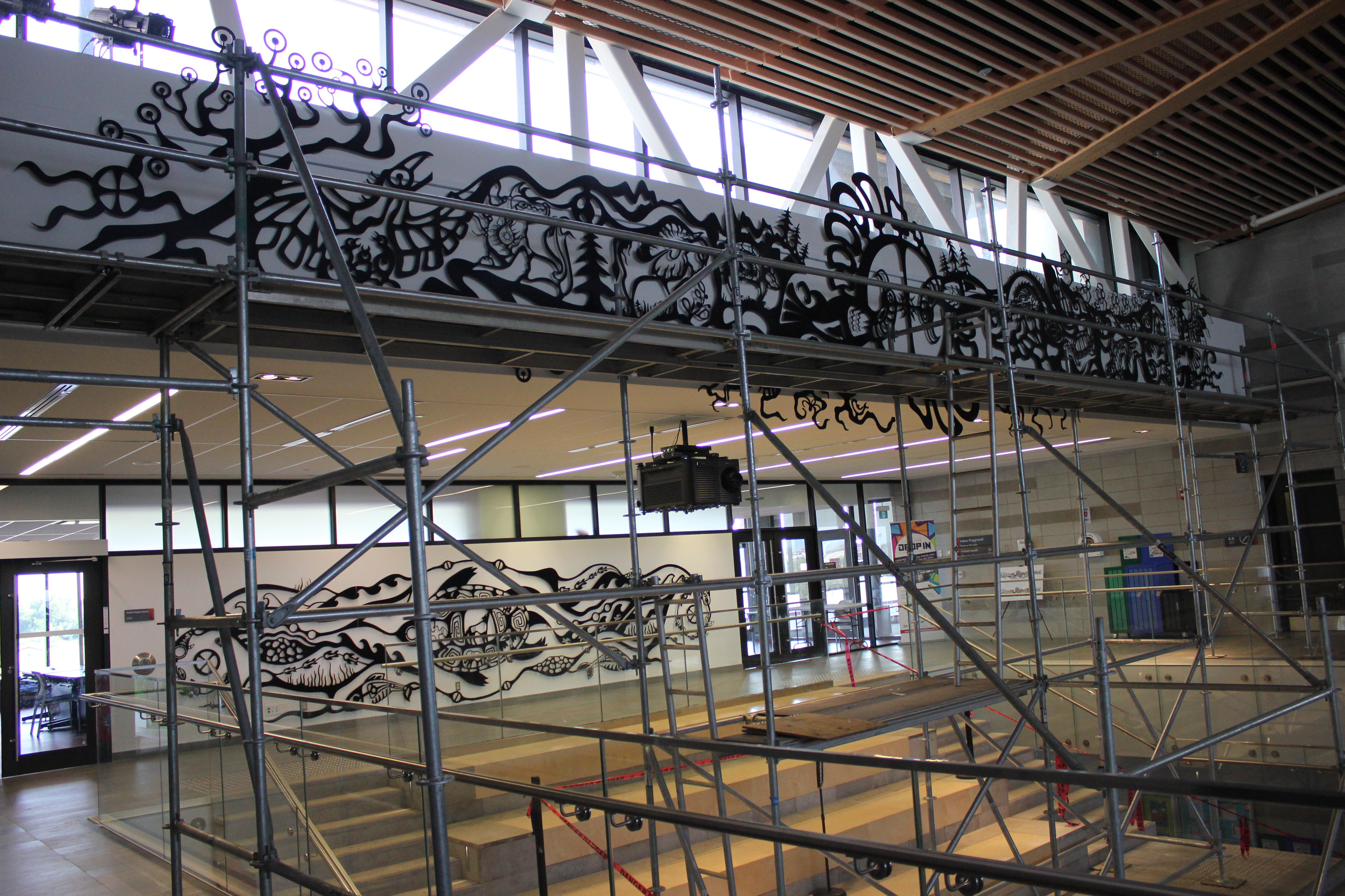 A portion of the Aaniin Community Centre mural under construction.